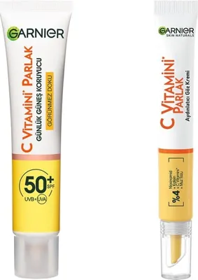 Garnier C Vitamini Günlük Uv Korumalı Güneş Yüz Kremi SPF50 Görünmez Doku 40ML & C Vitamini Parlak Aydınlatıcı Göz Kremi Cilt Bakım Seti
